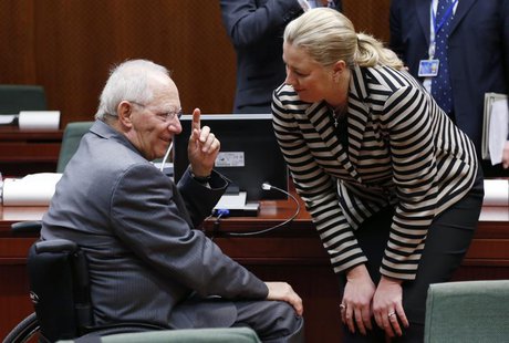 Germany's Finance Minister Wolfgang Schaeuble talks to his Finnish counterpart Jutta Urpilainen (R) during a European Union finance minister Germany's Finance Minister Wolfgang Schaeuble talks to his Finnish counterpart Jutta Urpilainen (R) during a European Union finance minister