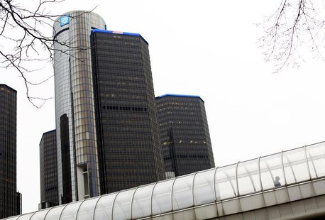 A man walks through a pedestrian bridge near the General Motors headquarters in Detroit, Michigan December 3, 2013. REUTERS/Joshua Lott A man walks through a pedestrian bridge near the General Motors headquarters in Detroit, Michigan December 3, 2013. REUTERS/Joshua Lott
