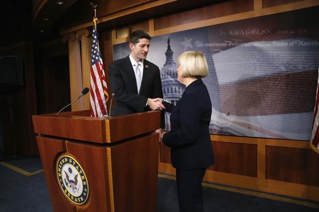 Senate Budget Committee chairman Senator Patty Murray (D-WA) (R) and House Budget Committee chairman Representative Paul Ryan (R-WI) shake h Senate Budget Committee chairman Senator Patty Murray (D-WA) (R) and House Budget Committee chairman Representative Paul Ryan (R-WI) shake h