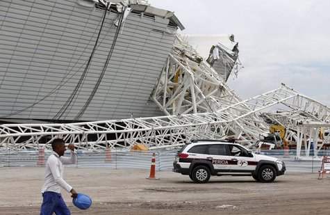 A forensic police car arrives at the scene a collapsed crane at the Arena Sao Paulo stadium, known as "Itaquerao", in Sao Paulo December 2, A forensic police car arrives at the scene a collapsed crane at the Arena Sao Paulo stadium, known as "Itaquerao", in Sao Paulo December 2,