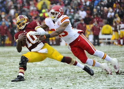 Dec 8, 2013; Landover, MD, USA; Washington Redskins quarterback Robert Griffin III (10) is tackled by Kansas City Chiefs safety Eric Berry ( Dec 8, 2013; Landover, MD, USA; Washington Redskins quarterback Robert Griffin III (10) is tackled by Kansas City Chiefs safety Eric Berry (