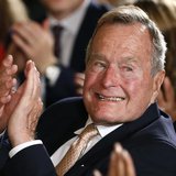 Former President George H. W. Bush applauds during an event to honor the winner of the 5,000th Daily Point of Light Award at the White House Former President George H. W. Bush applauds during an event to honor the winner of the 5,000th Daily Point of Light Award at the White House