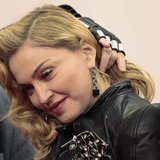 U.S. singer Madonna arrives to promote her latest gym in her Hard Candy Fitness centre chain in Berlin October 17, 2013. REUTERS/Tobias Schw U.S. singer Madonna arrives to promote her latest gym in her Hard Candy Fitness centre chain in Berlin October 17, 2013. REUTERS/Tobias Schw