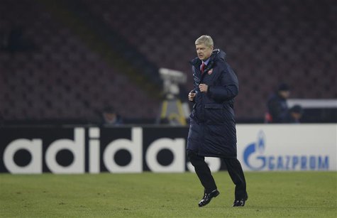 Arsenal's Coach Arsene Wenger leaves the pich at the half-time of the the Champions League soccer match against Naples at San Paolo stadium Arsenal's Coach Arsene Wenger leaves the pich at the half-time of the the Champions League soccer match against Naples at San Paolo stadium