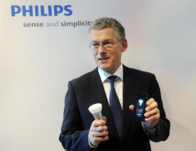 Philips Electronics Chief Executive Frans van Houten shows a LED bulb which can be controlled directly from an iOS or Android device, during Philips Electronics Chief Executive Frans van Houten shows a LED bulb which can be controlled directly from an iOS or Android device, during