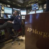 A trader works at the JP Morgan stall on the floor of the New York Stock Exchange, November 19, 2013. REUTERS/Brendan McDermid A trader works at the JP Morgan stall on the floor of the New York Stock Exchange, November 19, 2013. REUTERS/Brendan McDermid