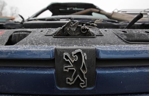 The Peugeot logo is seen on a vehicle at an auto scrap yard in Vendenheim near Strasbourg, November 27, 2013. REUTERS/Vincent Kessler The Peugeot logo is seen on a vehicle at an auto scrap yard in Vendenheim near Strasbourg, November 27, 2013. REUTERS/Vincent Kessler
