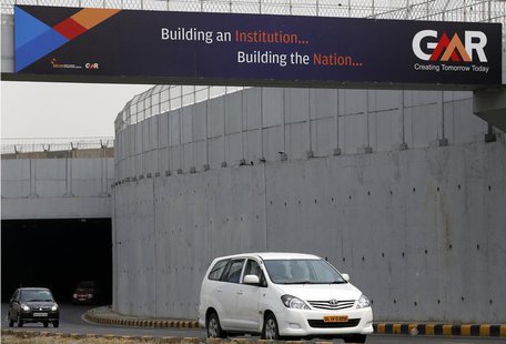 Vehicles cross through an underpass constructed by GMR Infrastructure that connects to the airport in New Delhi, May 13, 2013. REUTERS/Anind Vehicles cross through an underpass constructed by GMR Infrastructure that connects to the airport in New Delhi, May 13, 2013. REUTERS/Anind