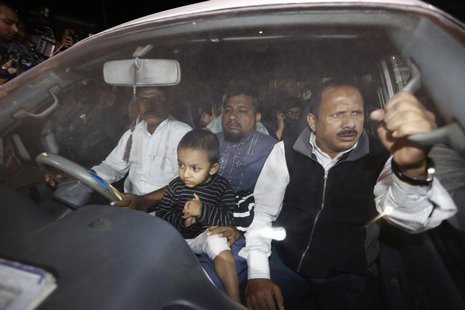 Relatives of Islamist leader Abdul Quader Mollah seated in a vehicle come out of Dhaka Central Jail after meeting him in Dhaka December 10, Relatives of Islamist leader Abdul Quader Mollah seated in a vehicle come out of Dhaka Central Jail after meeting him in Dhaka December 10,