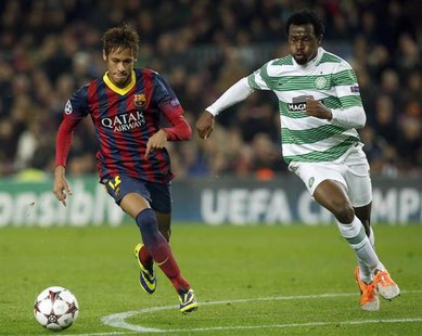 Barcelona's Neymar (L) and Celtic's Efe Ambrose challenge for the ball during their Champions League soccer match at Camp Nou stadium in Bar Barcelona's Neymar (L) and Celtic's Efe Ambrose challenge for the ball during their Champions League soccer match at Camp Nou stadium in Bar