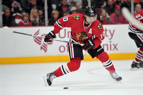 Dec 11, 2013; Chicago, IL, USA; Chicago Blackhawks left wing Patrick Sharp (10) shoots against the Philadelphia Flyers during the second per Dec 11, 2013; Chicago, IL, USA; Chicago Blackhawks left wing Patrick Sharp (10) shoots against the Philadelphia Flyers during the second per