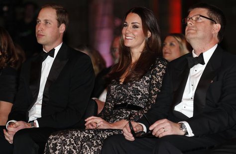 Britain's Prince William (L-R) and his wife Catherine, the Duchess of Cambridge, sit with Natural History Museum Director Michael Dixon befo Britain's Prince William (L-R) and his wife Catherine, the Duchess of Cambridge, sit with Natural History Museum Director Michael Dixon befo