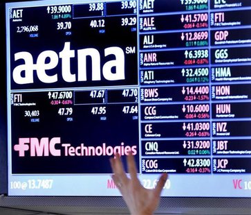 A trader points up at a display on the floor of the New York Stock Exchange August 20, 2012. REUTERS/Brendan McDermid A trader points up at a display on the floor of the New York Stock Exchange August 20, 2012. REUTERS/Brendan McDermid
