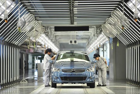 Employees work at the third factory of Dongfeng Peugeot Citroen Automobile company, after its inauguration ceremony, in Wuhan, in this July Employees work at the third factory of Dongfeng Peugeot Citroen Automobile company, after its inauguration ceremony, in Wuhan, in this July