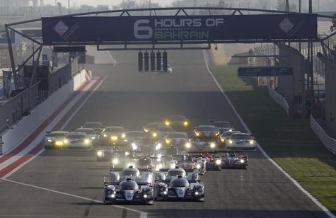 Race cars compete during the start of the final race of the 2013 World Endurance Championship (WEC) Six Hours of Bahrain at the Bahrain Inte Race cars compete during the start of the final race of the 2013 World Endurance Championship (WEC) Six Hours of Bahrain at the Bahrain Inte
