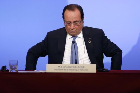 France's President Francois Hollande attends a news conference at the Elysee Palace at the end of the Elysee Summit for Peace and Security i France's President Francois Hollande attends a news conference at the Elysee Palace at the end of the Elysee Summit for Peace and Security i