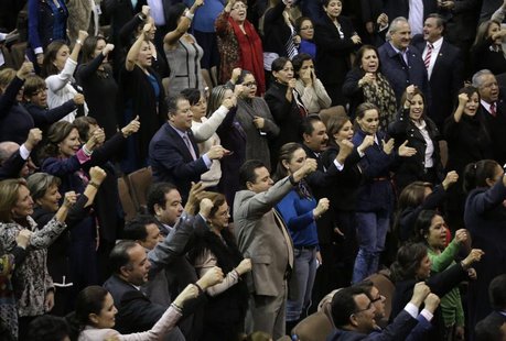 Mexican congressmen celebrate after the lower house gave the final approval to a landmark energy reform in Mexico City December 12, 2013. RE Mexican congressmen celebrate after the lower house gave the final approval to a landmark energy reform in Mexico City December 12, 2013. RE
