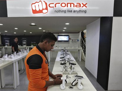 An employee stands at the counter of Micromax mobile phones at a showroom in New Delhi December 6, 2013. REUTERS/Adnan Abidi An employee stands at the counter of Micromax mobile phones at a showroom in New Delhi December 6, 2013. REUTERS/Adnan Abidi