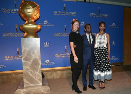 (L-R) Actors Olivia Wilde, Aziz Ansari and Zoe Saldana pose at the announcement of nominations for the 71st annual Golden Globe Awards in Be (L-R) Actors Olivia Wilde, Aziz Ansari and Zoe Saldana pose at the announcement of nominations for the 71st annual Golden Globe Awards in Be