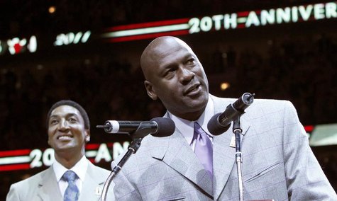Former Bulls star Michael Jordan (R) talks to the crowd while Scottie Pippen looks on during a ceremony to honor the 20th anniversary of the Former Bulls star Michael Jordan (R) talks to the crowd while Scottie Pippen looks on during a ceremony to honor the 20th anniversary of the