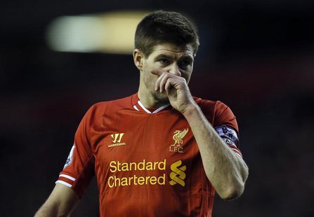Liverpool's Steven Gerrard wipes his face during their English Premier League soccer match against West Ham United at Anfield in Liverpool, Liverpool's Steven Gerrard wipes his face during their English Premier League soccer match against West Ham United at Anfield in Liverpool,