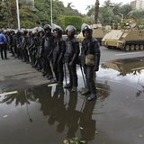 Egyptian security forces and army vehicles hold their positions outside Cairo university during clashes between riot policemen and Cairo Uni Egyptian security forces and army vehicles hold their positions outside Cairo university during clashes between riot policemen and Cairo Uni
