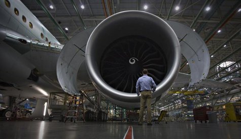 A worker stands in front of an engine on the Boeing 777 at their assembly operations in Everett, Washington, October 18, 2012. REUTERS/Andy A worker stands in front of an engine on the Boeing 777 at their assembly operations in Everett, Washington, October 18, 2012. REUTERS/Andy