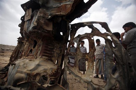 Boys gather near the wreckage of a car destroyed in 2012 by a U.S. drone air strike targeting suspected al Qaeda militants in Azan, in the s Boys gather near the wreckage of a car destroyed in 2012 by a U.S. drone air strike targeting suspected al Qaeda militants in Azan, in the s