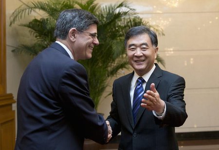 U.S. Treasury Secretary Jack Lew (L) shakes hands with Chinese Vice Premier Wang Yang as they arrive for a meeting at the Diaoyutai State Gu U.S. Treasury Secretary Jack Lew (L) shakes hands with Chinese Vice Premier Wang Yang as they arrive for a meeting at the Diaoyutai State Gu