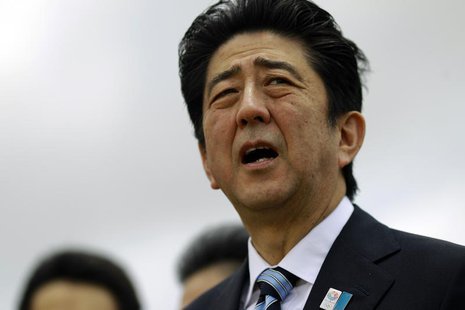 Japan's Prime Minster Shinzo Abe talks as he visits the Myanmar International Terminal Thilawa (MITT) port outside Yangon May 25, 2013. REUT Japan's Prime Minster Shinzo Abe talks as he visits the Myanmar International Terminal Thilawa (MITT) port outside Yangon May 25, 2013. REUT