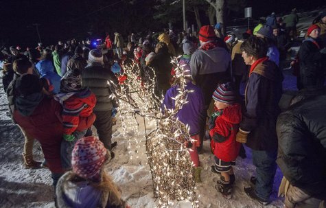 Some of the hundreds who gathered to attend the 29th annual Ram Pasture Tree Lighting look on in Newtown, Connecticut December 11, 2013 . De Some of the hundreds who gathered to attend the 29th annual Ram Pasture Tree Lighting look on in Newtown, Connecticut December 11, 2013 . De