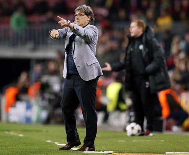 Barcelona's coach Gerardo "Tata" Martino gives instructions during their Champions League soccer match against Celtic at Camp Nou stadium in Barcelona's coach Gerardo "Tata" Martino gives instructions during their Champions League soccer match against Celtic at Camp Nou stadium in