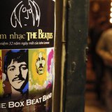 A fan walks near a poster promoting a tribute concert which marks the 32nd death anniversary of British legendary rocker John Lennon of the A fan walks near a poster promoting a tribute concert which marks the 32nd death anniversary of British legendary rocker John Lennon of the