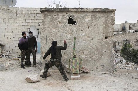 A member of the Free Syrian Army runs after placing a mortar shell inside a launcher during what activists said were clashes with pro-govern A member of the Free Syrian Army runs after placing a mortar shell inside a launcher during what activists said were clashes with pro-govern