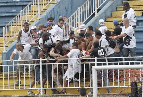 Vasco da Gama soccer fans beat up an Atletico Paranaense fan during their Brazilian championship match in Joinville in Santa Catarina state Vasco da Gama soccer fans beat up an Atletico Paranaense fan during their Brazilian championship match in Joinville in Santa Catarina state