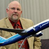 Aerospace Machinist Industrial District Lodge 751 president Tom Wroblewski sits behind a model of the Boeing 787 Dreamliner jet at his union Aerospace Machinist Industrial District Lodge 751 president Tom Wroblewski sits behind a model of the Boeing 787 Dreamliner jet at his union
