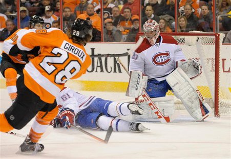 Philadelphia Flyers center Claude Giroux (28) scores against Montreal Canadiens goalie Carey Price (31) during the second period at Wells Fa Philadelphia Flyers center Claude Giroux (28) scores against Montreal Canadiens goalie Carey Price (31) during the second period at Wells Fa