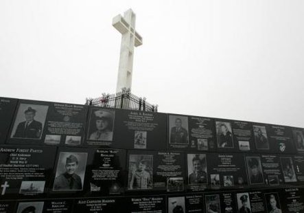 The Mount Soledad cross stands over memorials from the National War Memorial in Ja Jolla, California May 11, 2006.
CREDIT: REUTERS/MIKE BLAKE The Mount Soledad cross stands over memorials from the National War Memorial in Ja Jolla, California May 11, 2006.
CREDIT: REUTERS/MIKE BLAKE