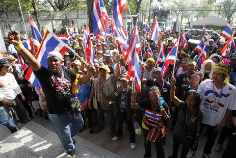 Anti-government protesters hold Thai national flags during a public seminar where protest leader and former deputy prime minister Suthep Tha Anti-government protesters hold Thai national flags during a public seminar where protest leader and former deputy prime minister Suthep Tha