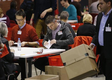 Volunteers of the Social Democratic Party count the ballots of the "Member Vote" for a new "grand coalition" between the Social Democratic P Volunteers of the Social Democratic Party count the ballots of the "Member Vote" for a new "grand coalition" between the Social Democratic P
