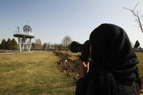 A photojournalist takes pictures at the Iranian Space Agency (ISA) in Mahdasht, about 60 km (37 miles) west of Tehran, February 29, 2012. RE A photojournalist takes pictures at the Iranian Space Agency (ISA) in Mahdasht, about 60 km (37 miles) west of Tehran, February 29, 2012. RE