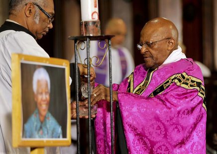 Former Archbishop of Cape Town and veteran anti-apartheid campaigner Desmond Tutu (R) holds a mass at Cape Town's Anglican St George's Cathe Former Archbishop of Cape Town and veteran anti-apartheid campaigner Desmond Tutu (R) holds a mass at Cape Town's Anglican St George's Cathe