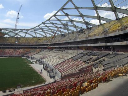 Steelworkers work on the roof structure above the pitch inside the Arena Amazonia stadium as constrcution continues in preparation for the 2 Steelworkers work on the roof structure above the pitch inside the Arena Amazonia stadium as constrcution continues in preparation for the 2