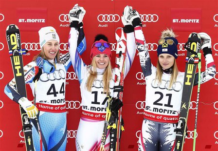 First placed Tina Weirather of Liechtenstein (C), second placed Kajsa Kling of Sweden (L) and third placed Anna Fenninger of Austria pose on First placed Tina Weirather of Liechtenstein (C), second placed Kajsa Kling of Sweden (L) and third placed Anna Fenninger of Austria pose on