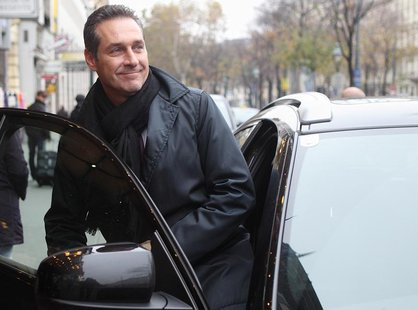 Head of the Austrian Freedom Party (FPOe) Heinz-Christian Strache enters his car after leaving a meeting with fellow European right-wing pol Head of the Austrian Freedom Party (FPOe) Heinz-Christian Strache enters his car after leaving a meeting with fellow European right-wing pol