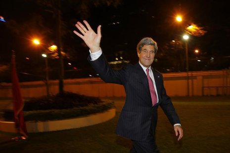 U.S. Secretary of State John Kerry waves to the crowd after greeting staff at the U.S. Consulate in Ho Chi Minh City December 14, 2013. REUT U.S. Secretary of State John Kerry waves to the crowd after greeting staff at the U.S. Consulate in Ho Chi Minh City December 14, 2013. REUT