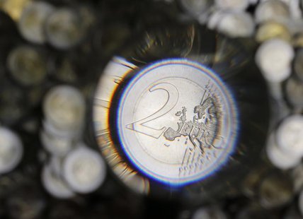 A two Euro coin is checked after being minted in the Austrian Mint (Muenze Oesterreich) headquarters in Vienna June 20, 2013. The Austrian m A two Euro coin is checked after being minted in the Austrian Mint (Muenze Oesterreich) headquarters in Vienna June 20, 2013. The Austrian m