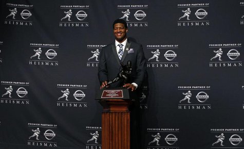 Dec 14, 2013; New York, NY, USA; Florida State Seminoles quarterback Jameis Winston poses for a photo after being awarded the 2013 Heisman T Dec 14, 2013; New York, NY, USA; Florida State Seminoles quarterback Jameis Winston poses for a photo after being awarded the 2013 Heisman T