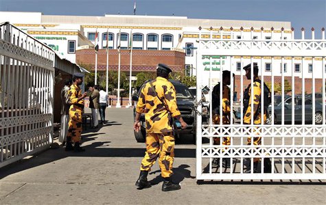 Police troopers secure the gate of a hospital where a Japanese diplomat is being treated in Sanaa December 15, 2013. REUTERS/Khaled Abdullah Police troopers secure the gate of a hospital where a Japanese diplomat is being treated in Sanaa December 15, 2013. REUTERS/Khaled Abdullah
