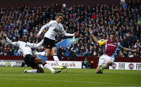 Manchester United's Danny Welbeck (L) scores his second goal against Aston Villa during their English Premier League soccer match at Villa P Manchester United's Danny Welbeck (L) scores his second goal against Aston Villa during their English Premier League soccer match at Villa P